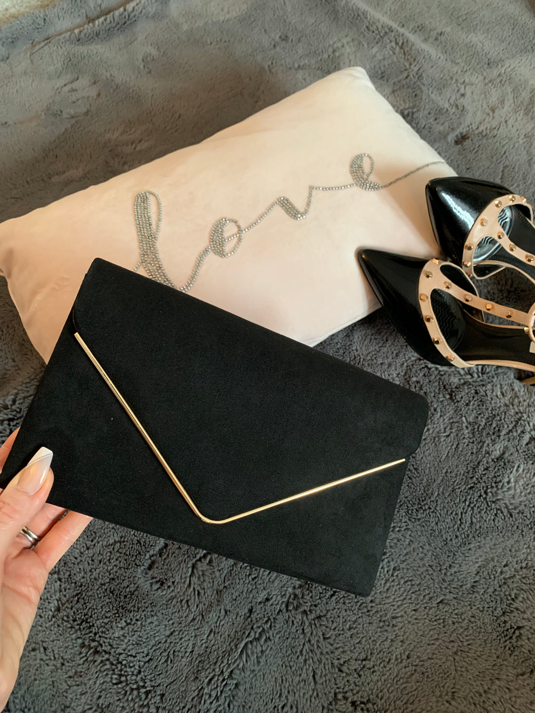 La Rochelle Black Suede Effect Clutch Bag with Gold Trim