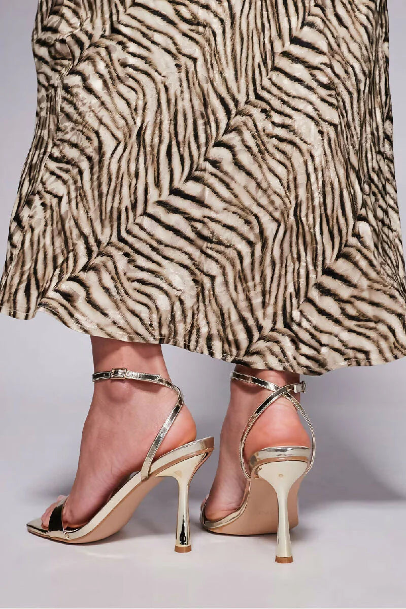 Vegas Strappy High Heeled Sandals In Gold